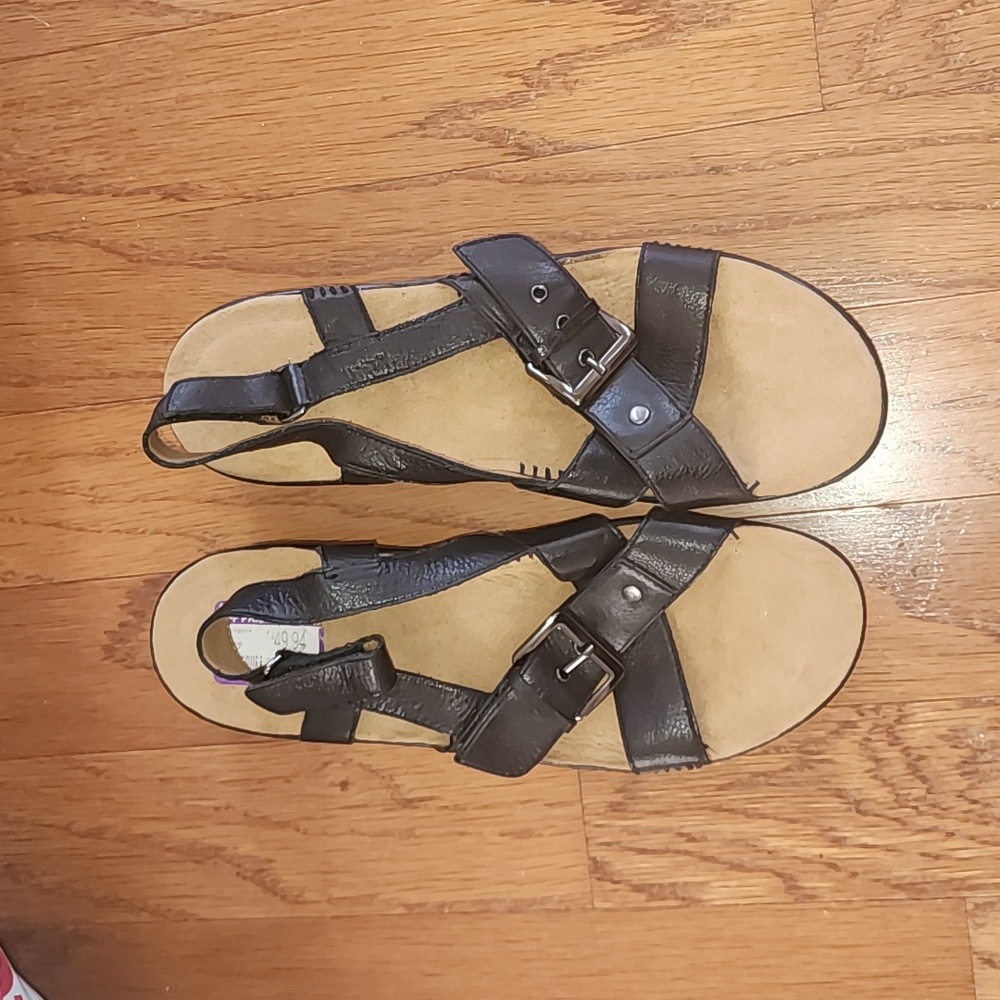 Black and tan sandals with a slight heal NWT